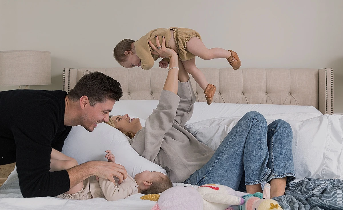 Family Enjoying Time with Babies on Adjustable Bed